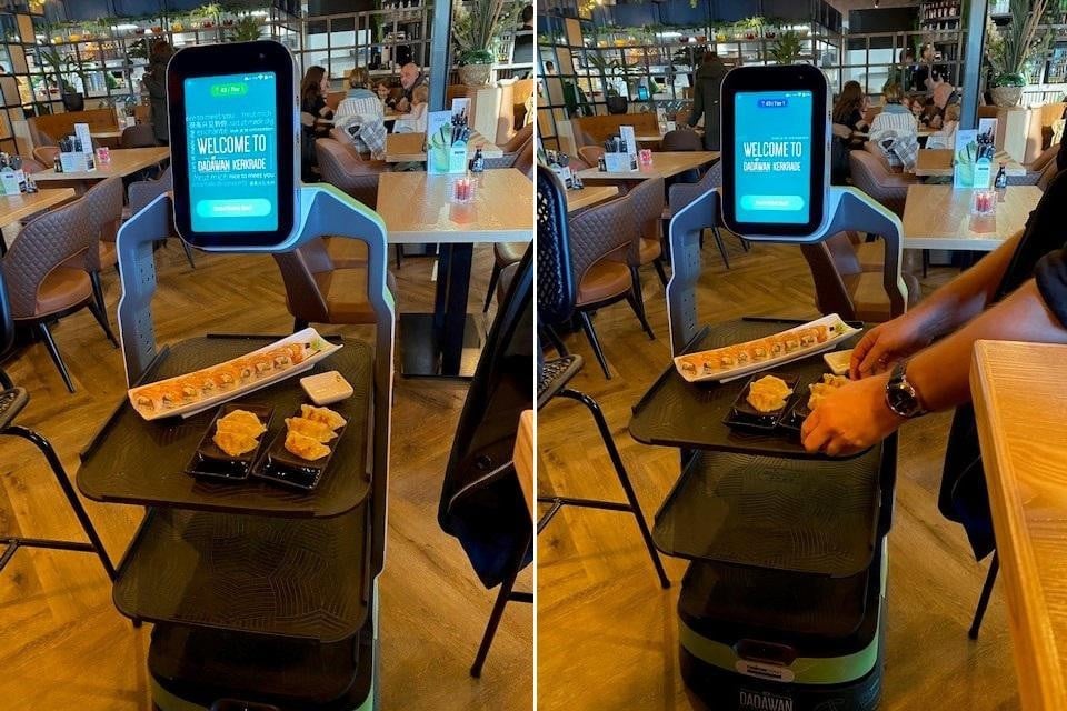 Een robot van Dadawan komt sushi en dumplings aan tafel brengen.